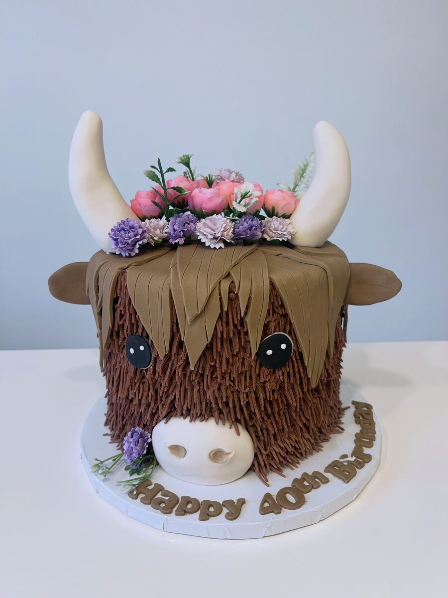 Highland cow celebration cake by Semires Cakes