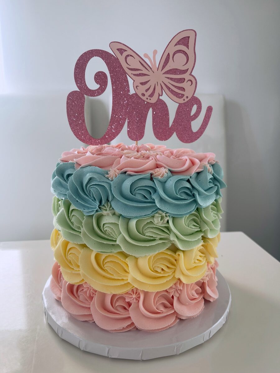 Pastel rainbow rosette first birthday cake
